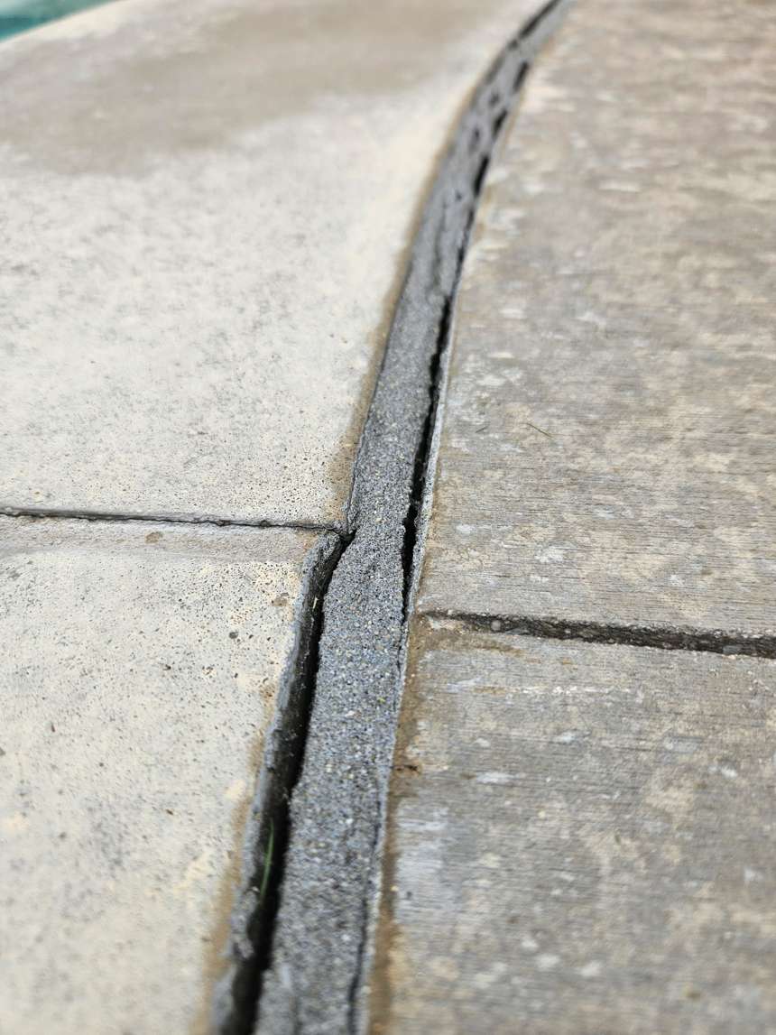Pool mastic joint pulling away from deck before repair