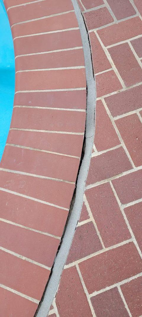Backer rod seated along the brick coping, ready for sealant