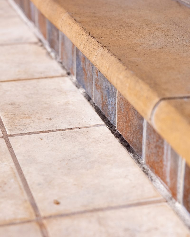 Failed pool deck expansion joint, old mastic gone and the gap open to the soil below